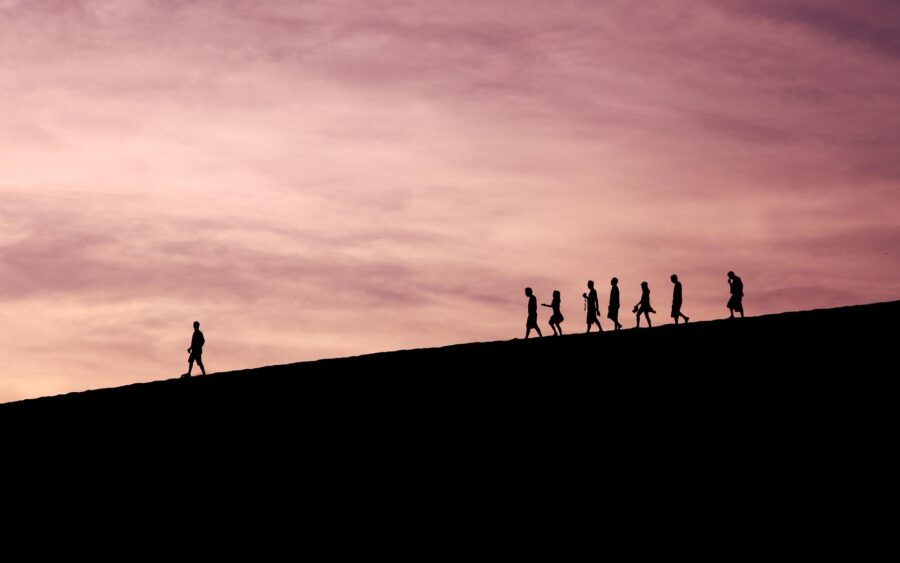 Photo of line of people following person for blog our back in person three-day leadership training program