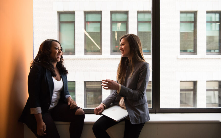 Two people talking in an office